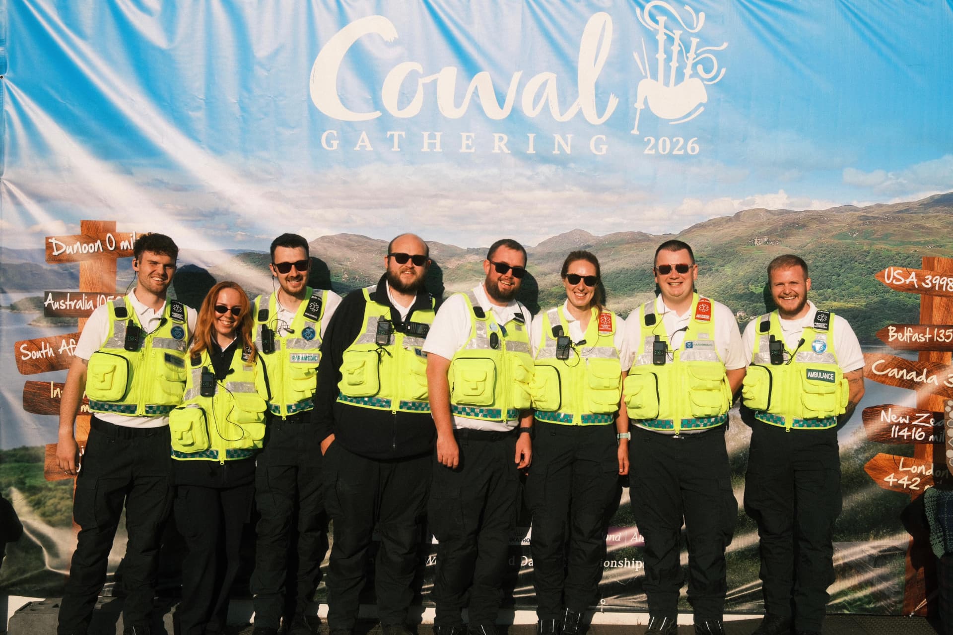 Alba EMS medics in high-visibility uniform in front of the Cowal Gathering banner